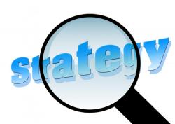 Magnifying glass over the word Strategy